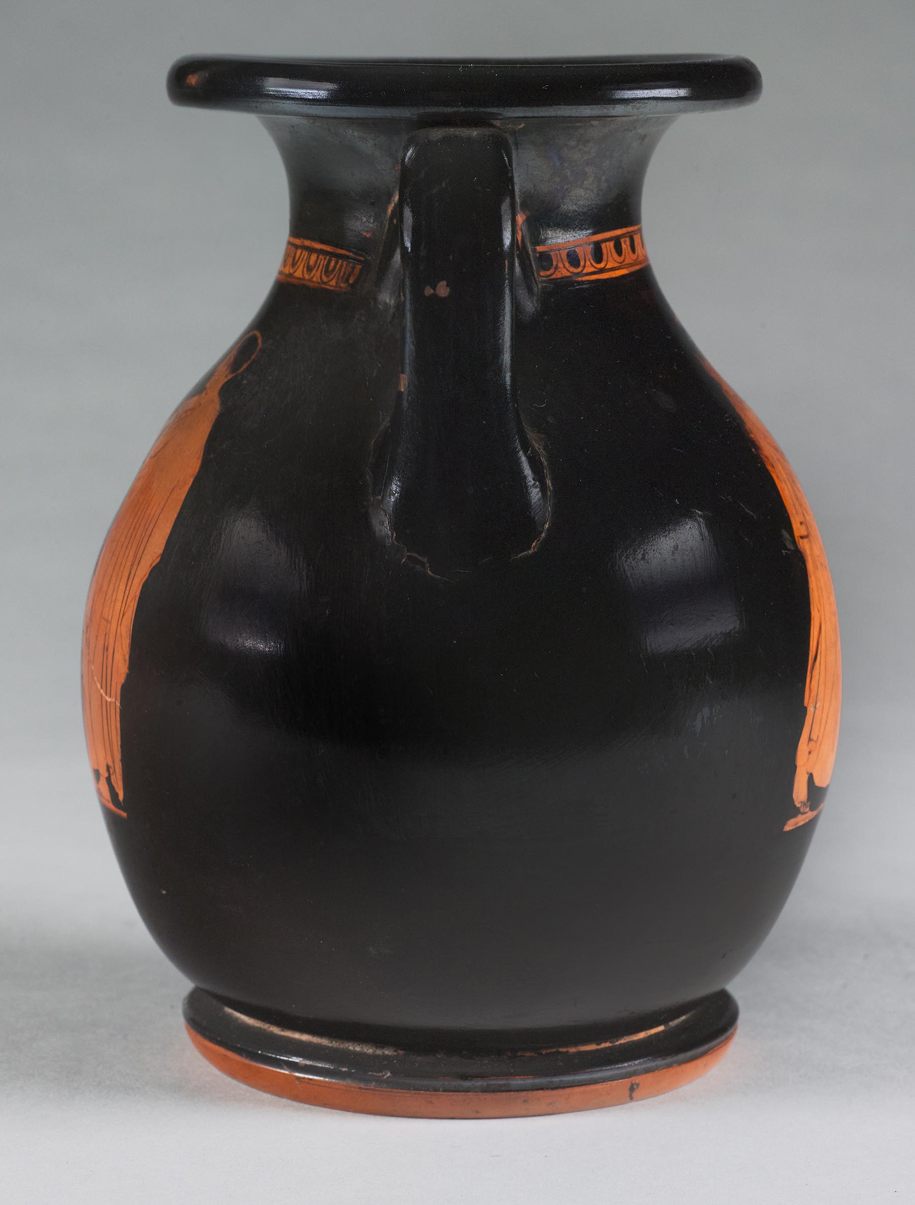 Side view of the vase, showing some decoration on the right side but not showing the figures