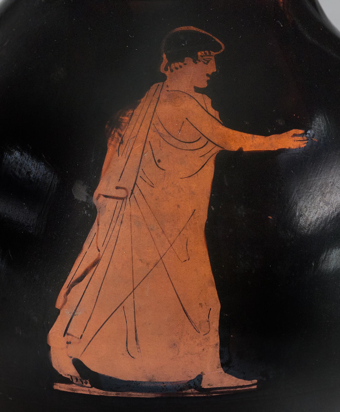 Detail showing a standing male youth