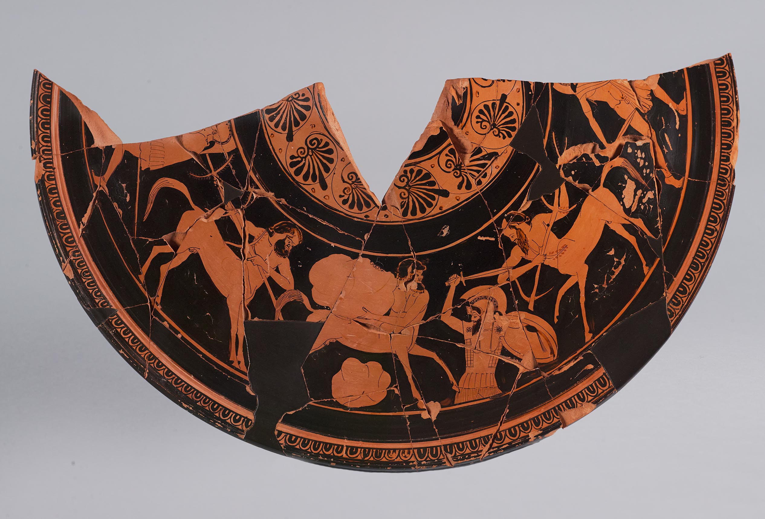 One view of a fragment from a lid, showing a Centauromachy, with death of Kaineus