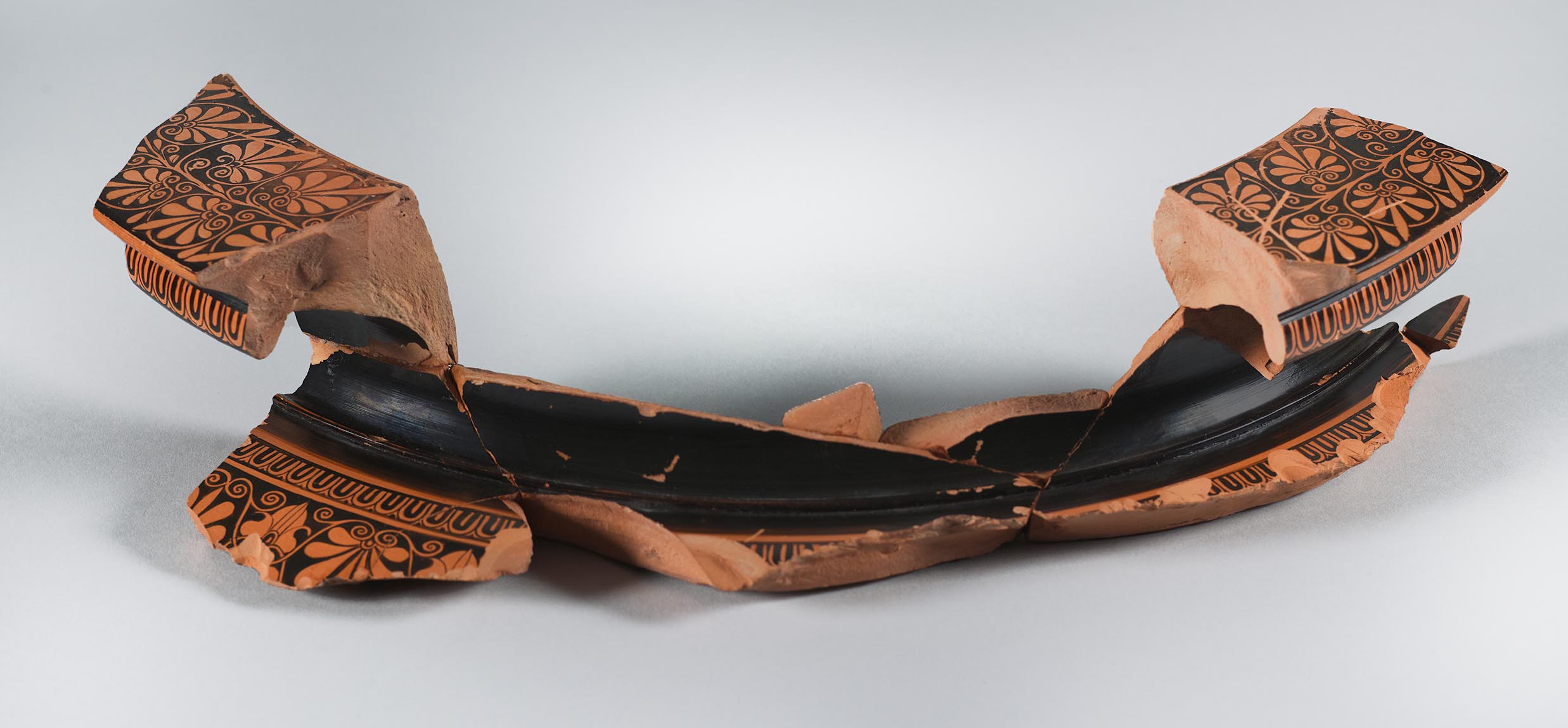 One view of a fragment from a vase, showing some decoration