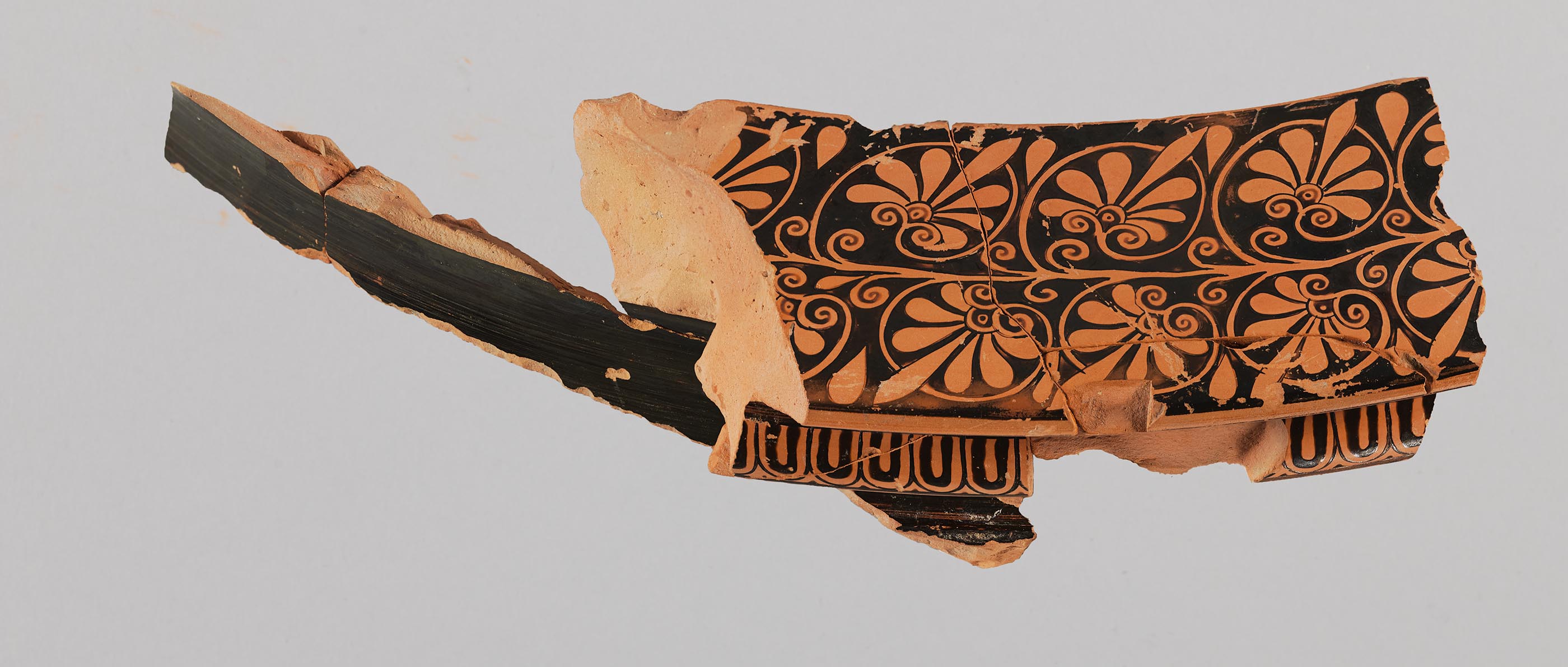 Another view of a fragment from a vase, showing some decoration