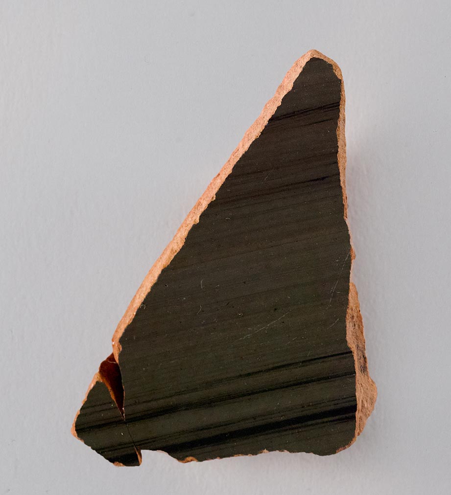 One fragment from the body of a vase, fired black