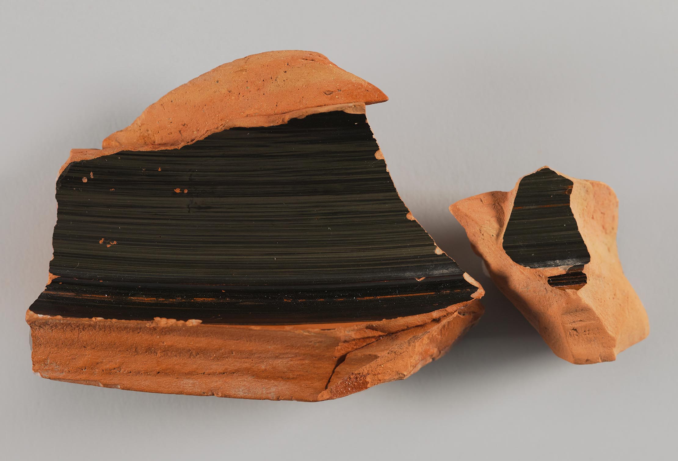 One view of a fragment from a vase, fired black