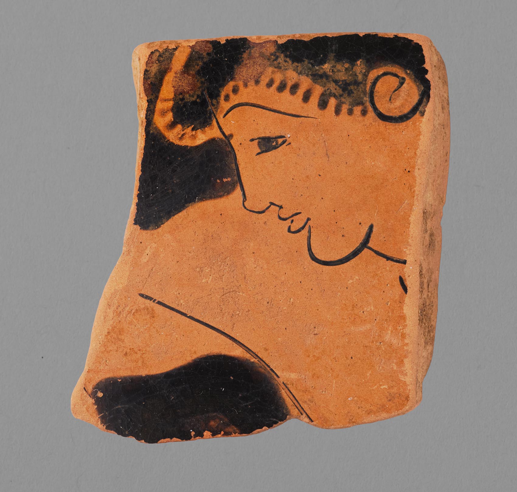 One view of a fragment from a vase, showing a male youth