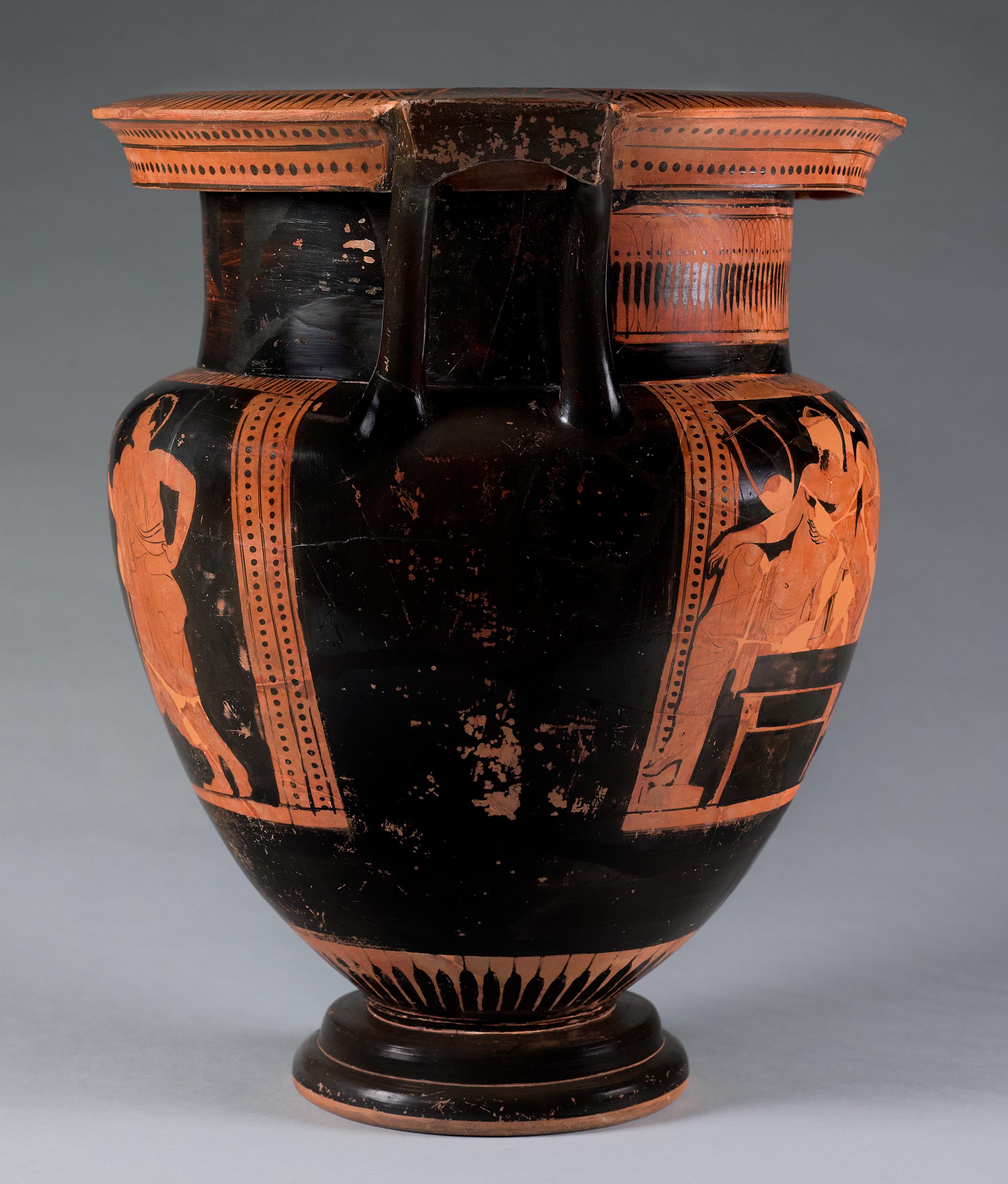 The other side of the vase, showing some decoration and partial figures on the left side