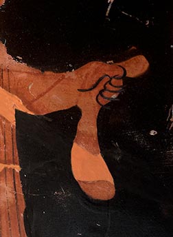 Detail showing the stirgil held by the leftmost figure