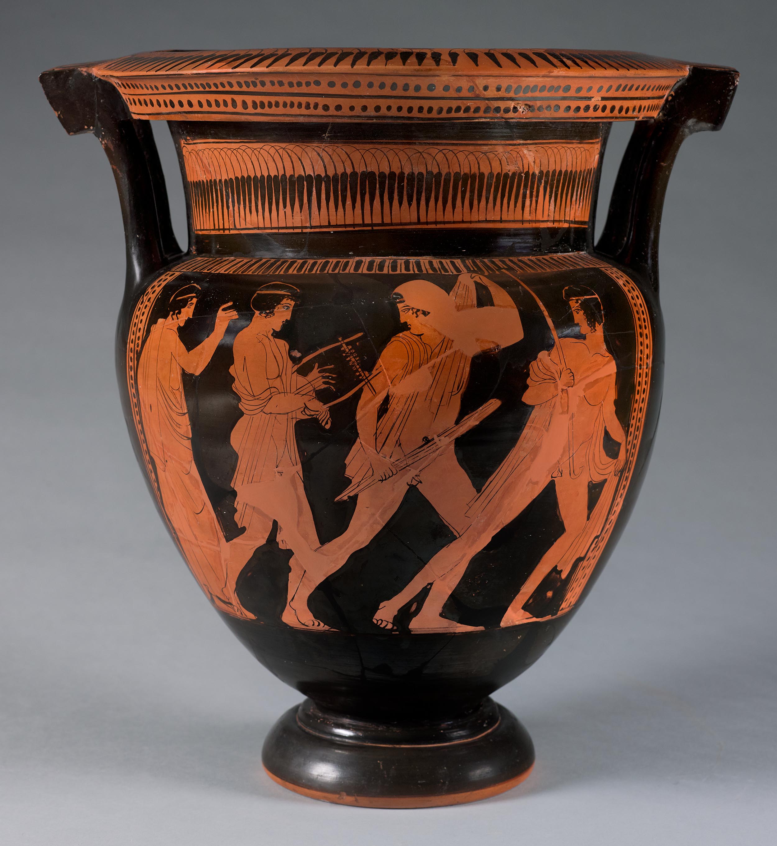 One view of a vase, the body depicting a komos performed by four beardless youth