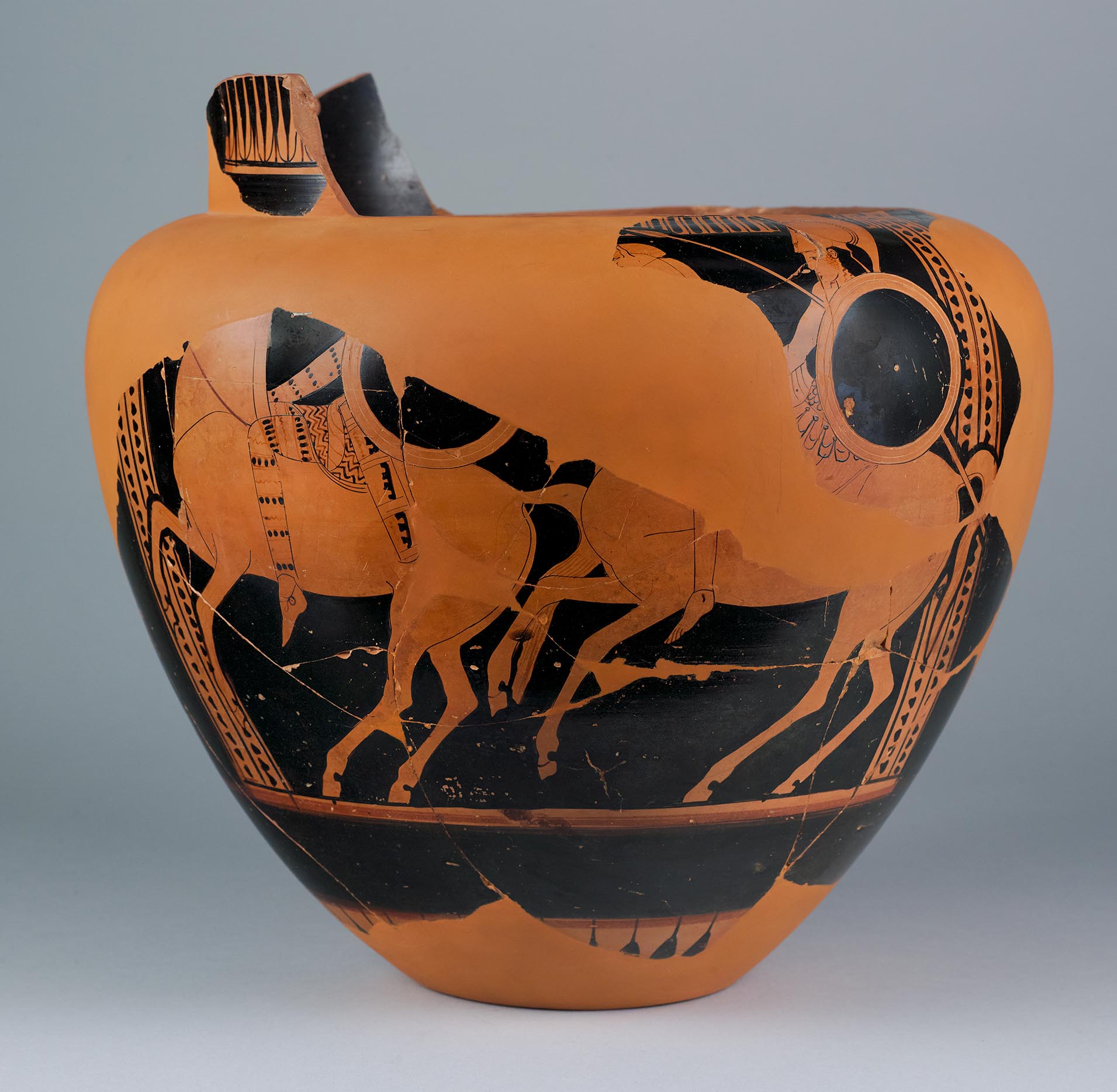 One view of fragments reconstructed to form most of a vase, the body depicting two Amazons riding in profile