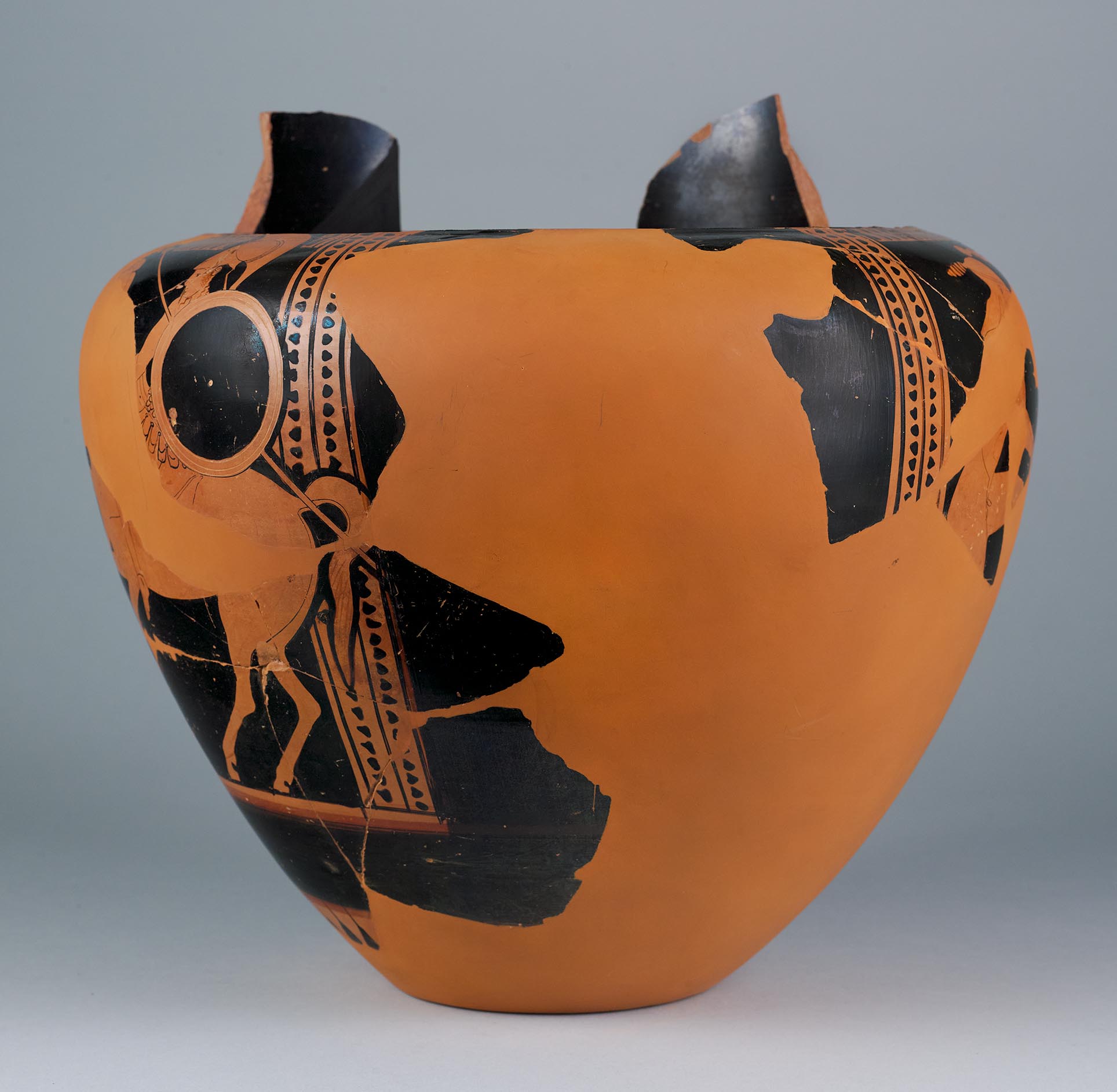 Side view of the vase, showing some decoration and partial figures on the right side 