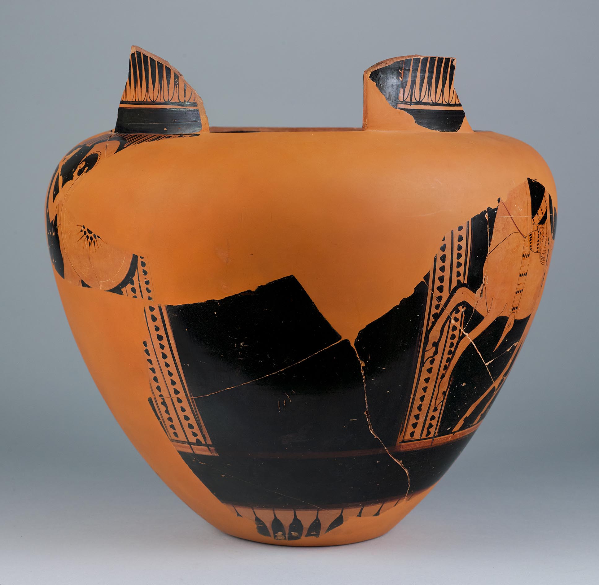 The other side of the vase, showing some decoration and partial figures on the left side