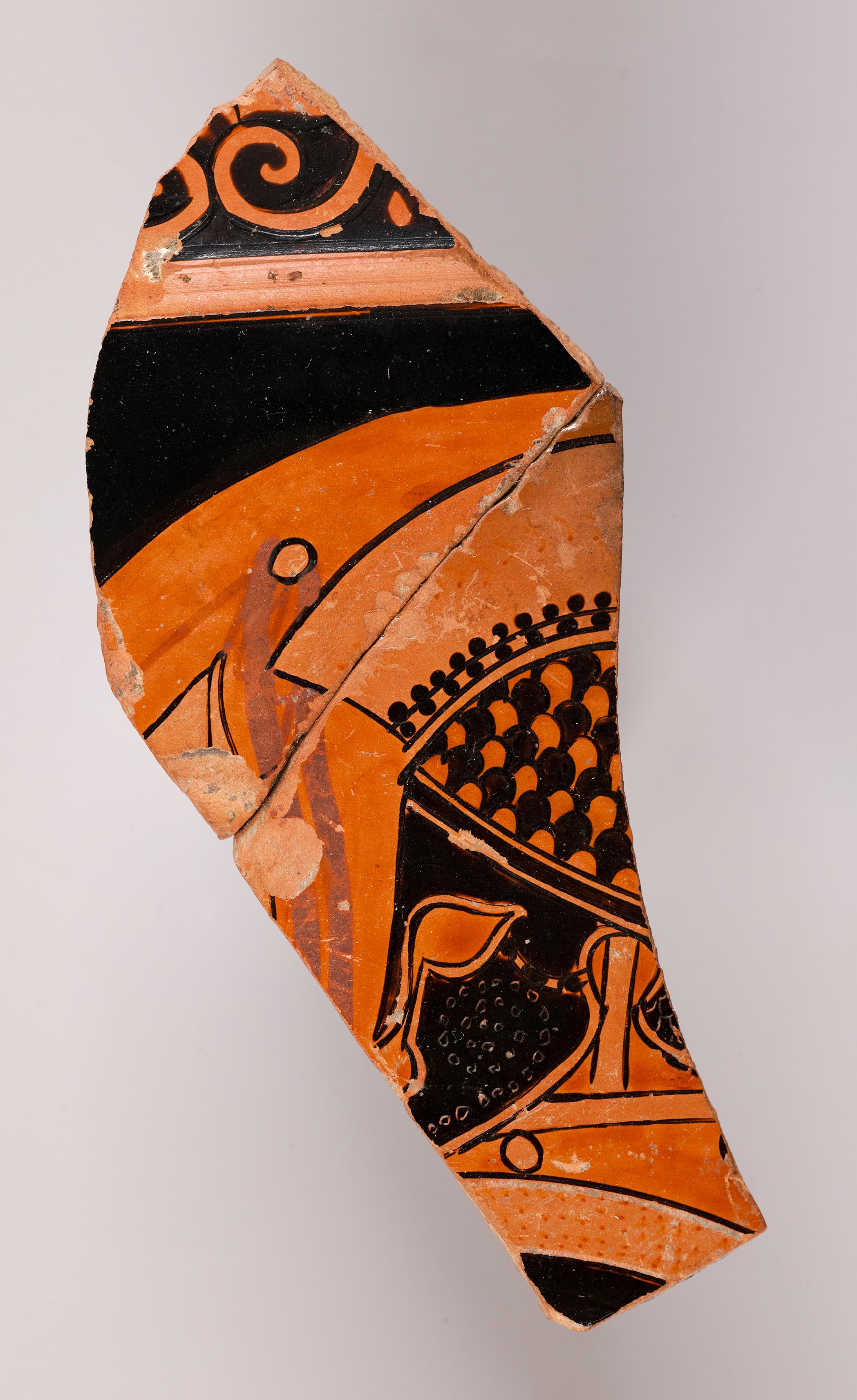 One fragment from a krater, depicting a helmet