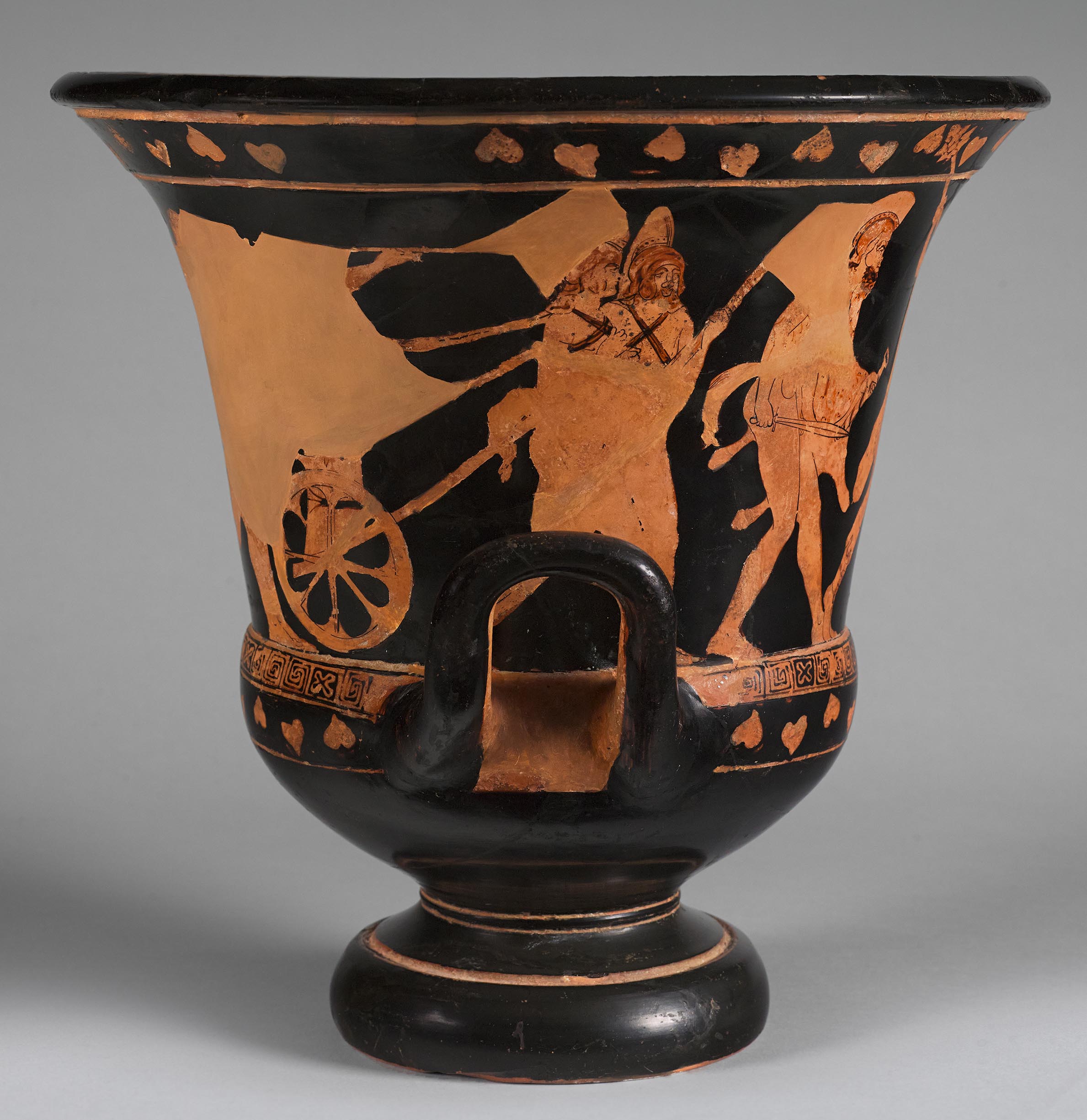 Side view of the vase, showing the figures on the left side