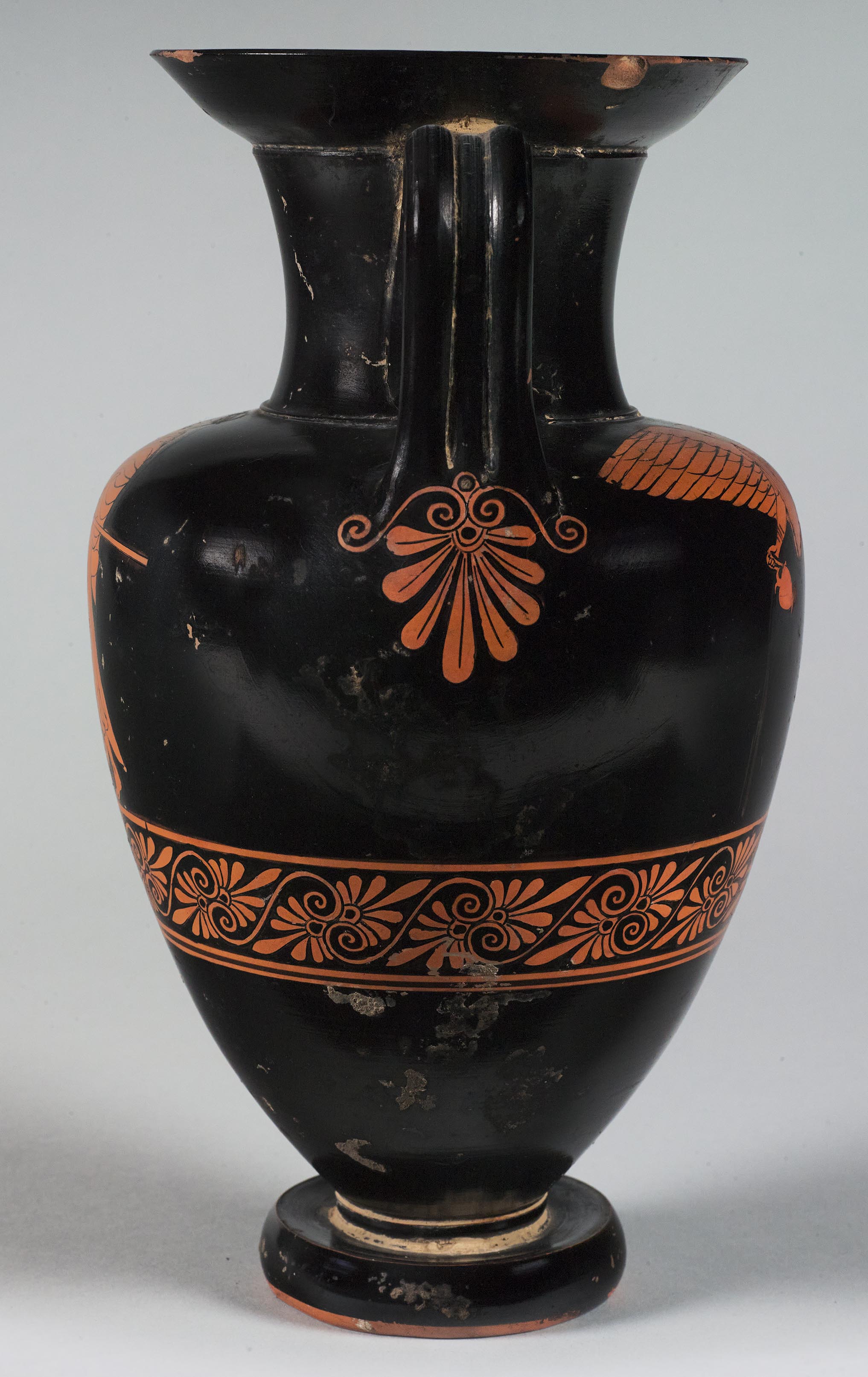 Side view of the vase, showing some decoration on the left side but not showing the figures