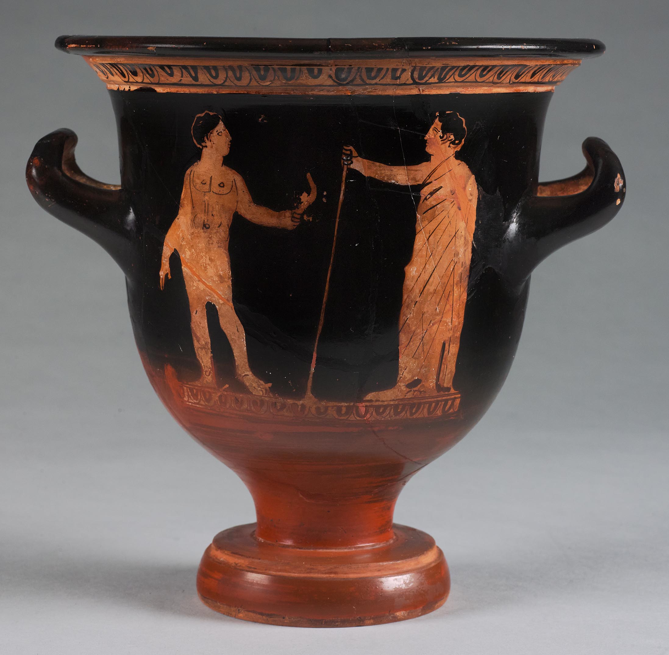 One view of a vase, the body depicting two beardless males in the gymnasium