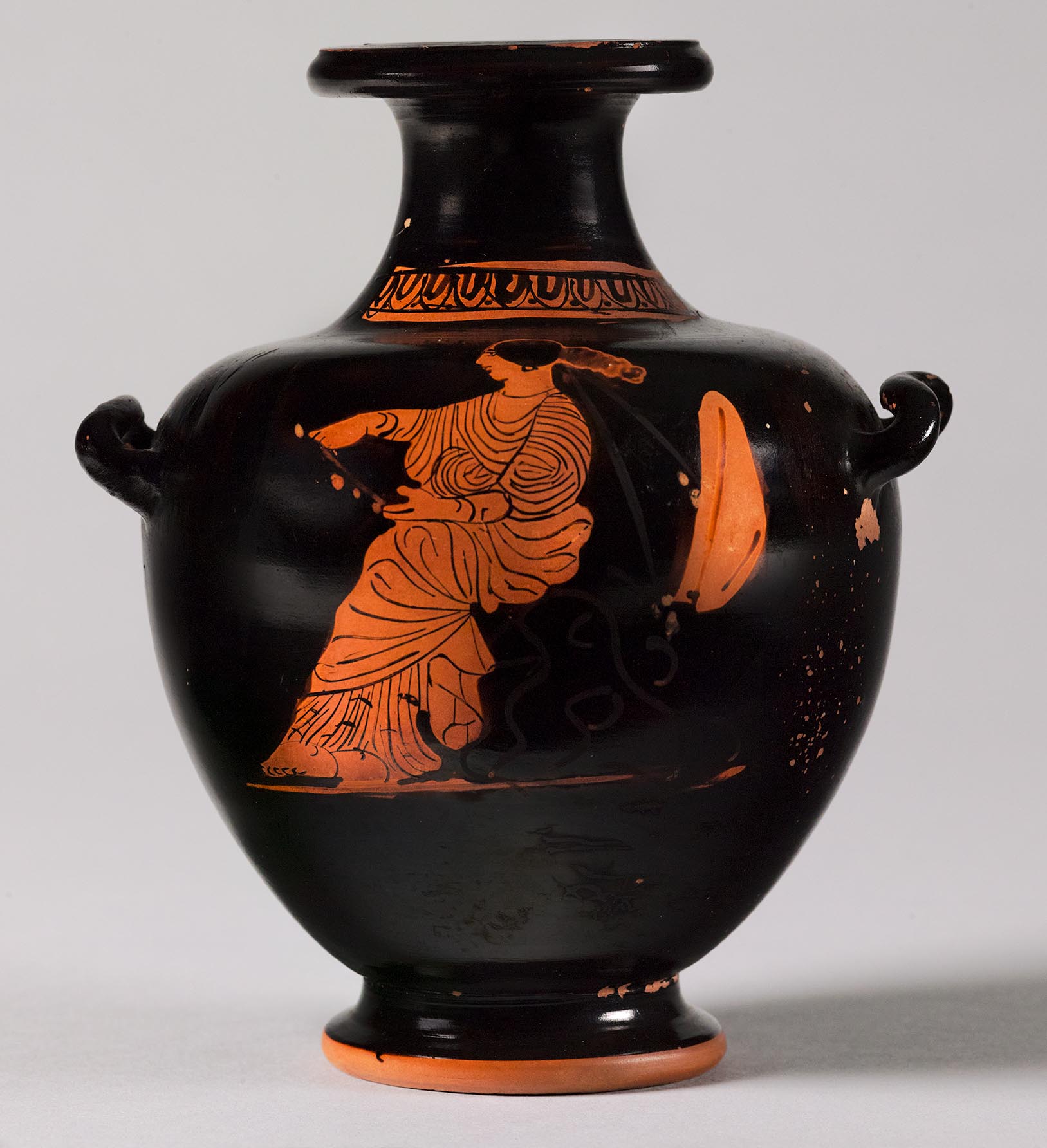 One view of a vase, the body depicting a seated woman