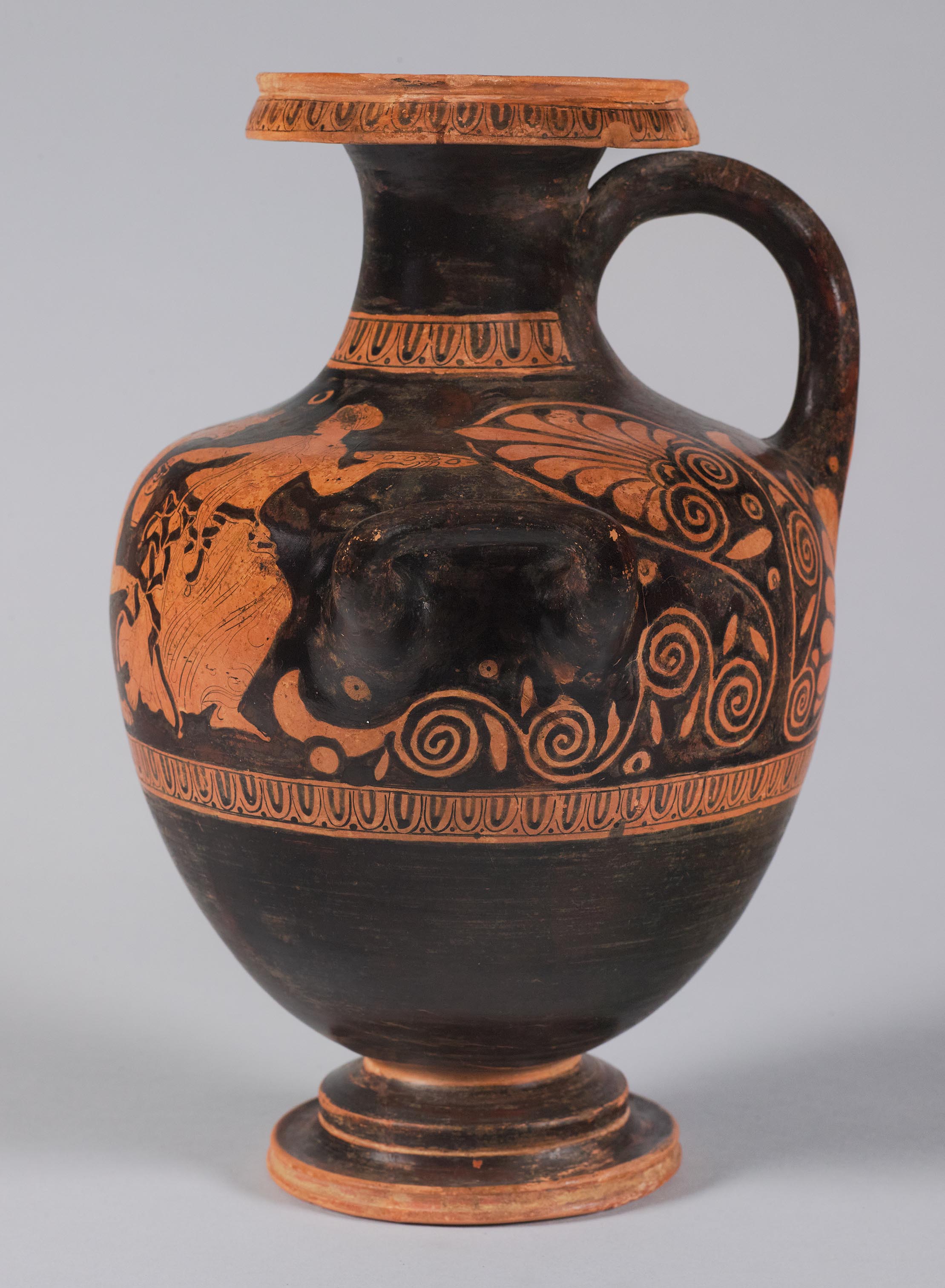 Side view of the vase, showing some decoration and a female figure on the right side 