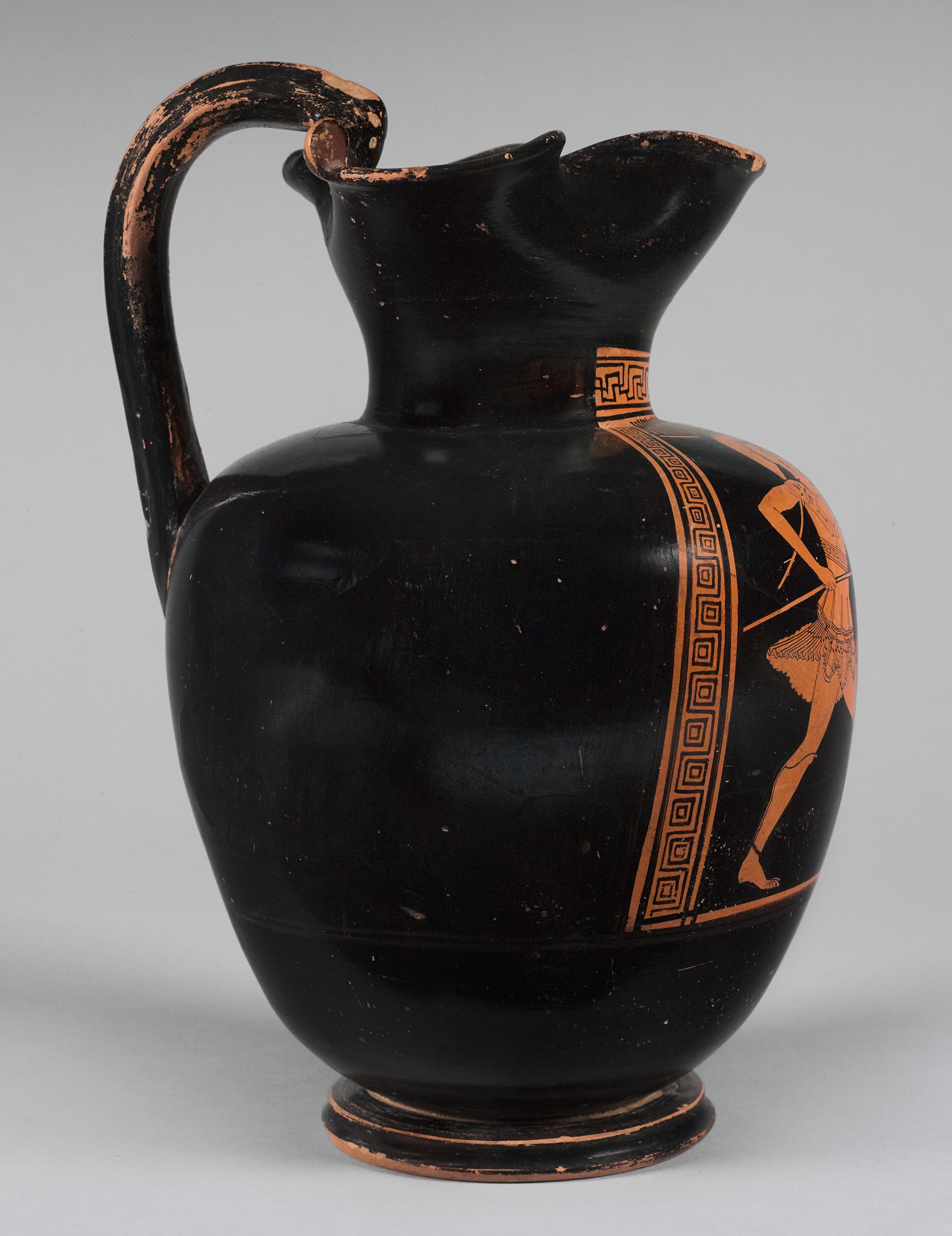 Side view of the vase, showing a partial figure on the left side