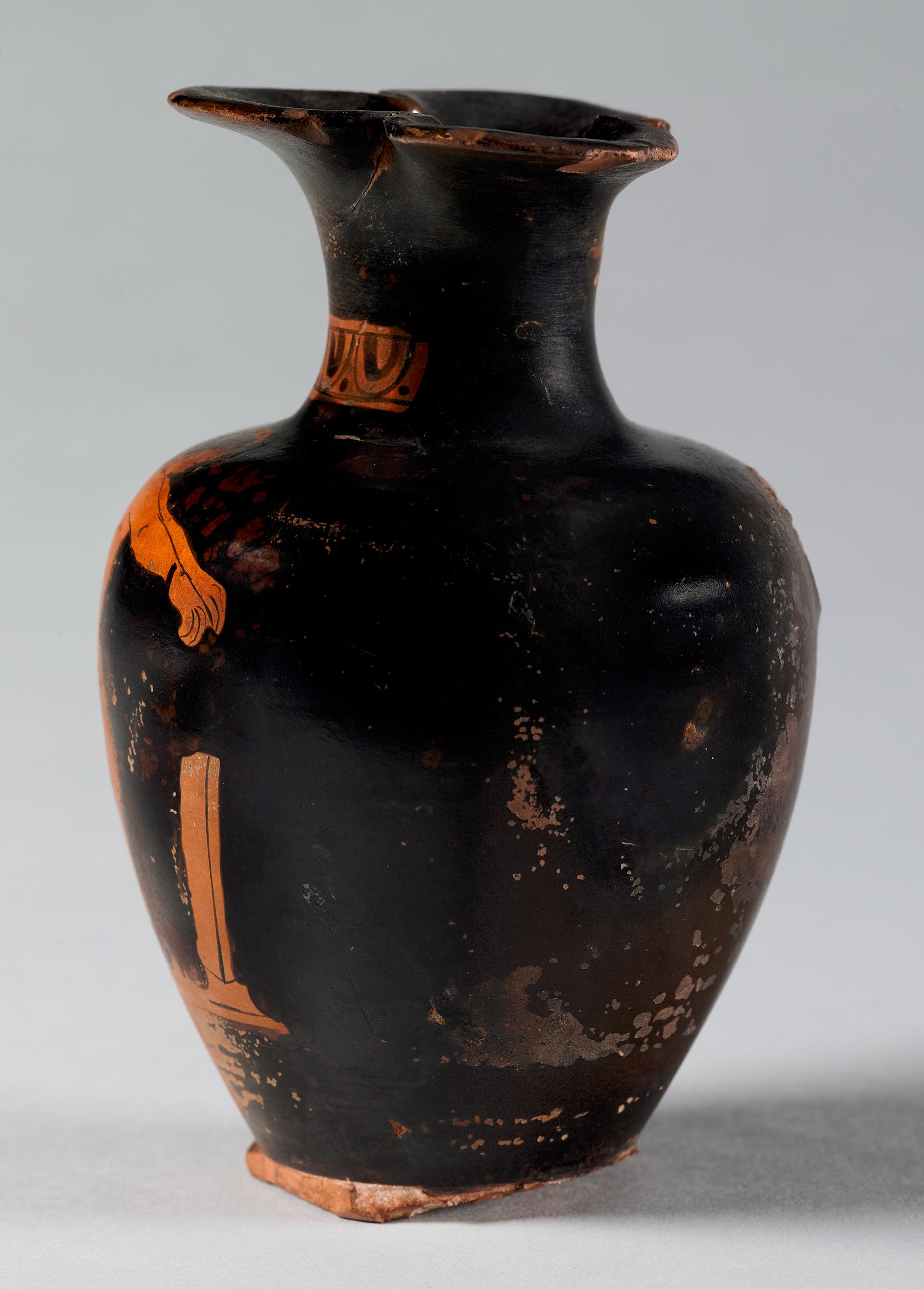 Side view of the vase, showing a partial figure on the right side