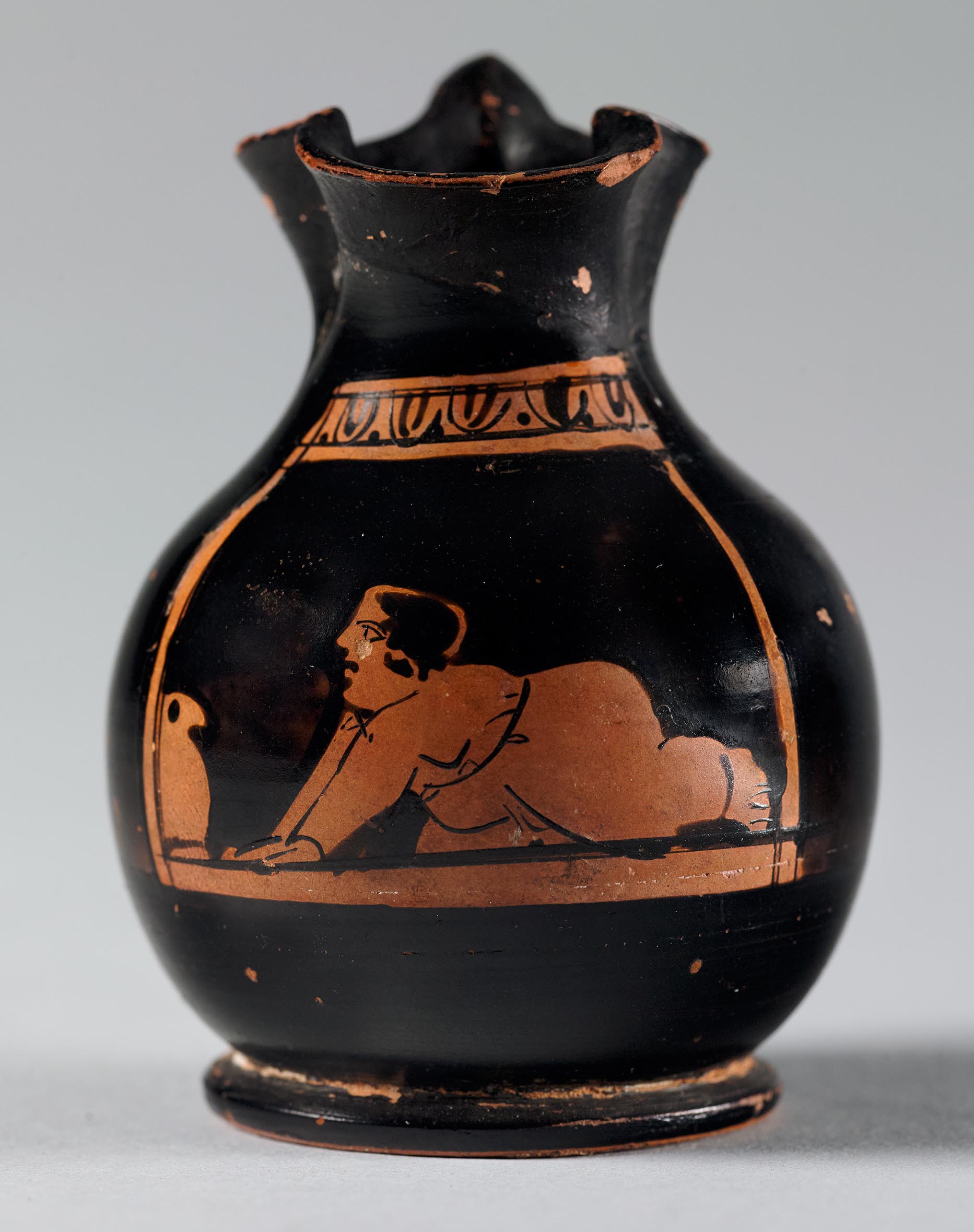 One view of a vase, the body depicting a crawling child