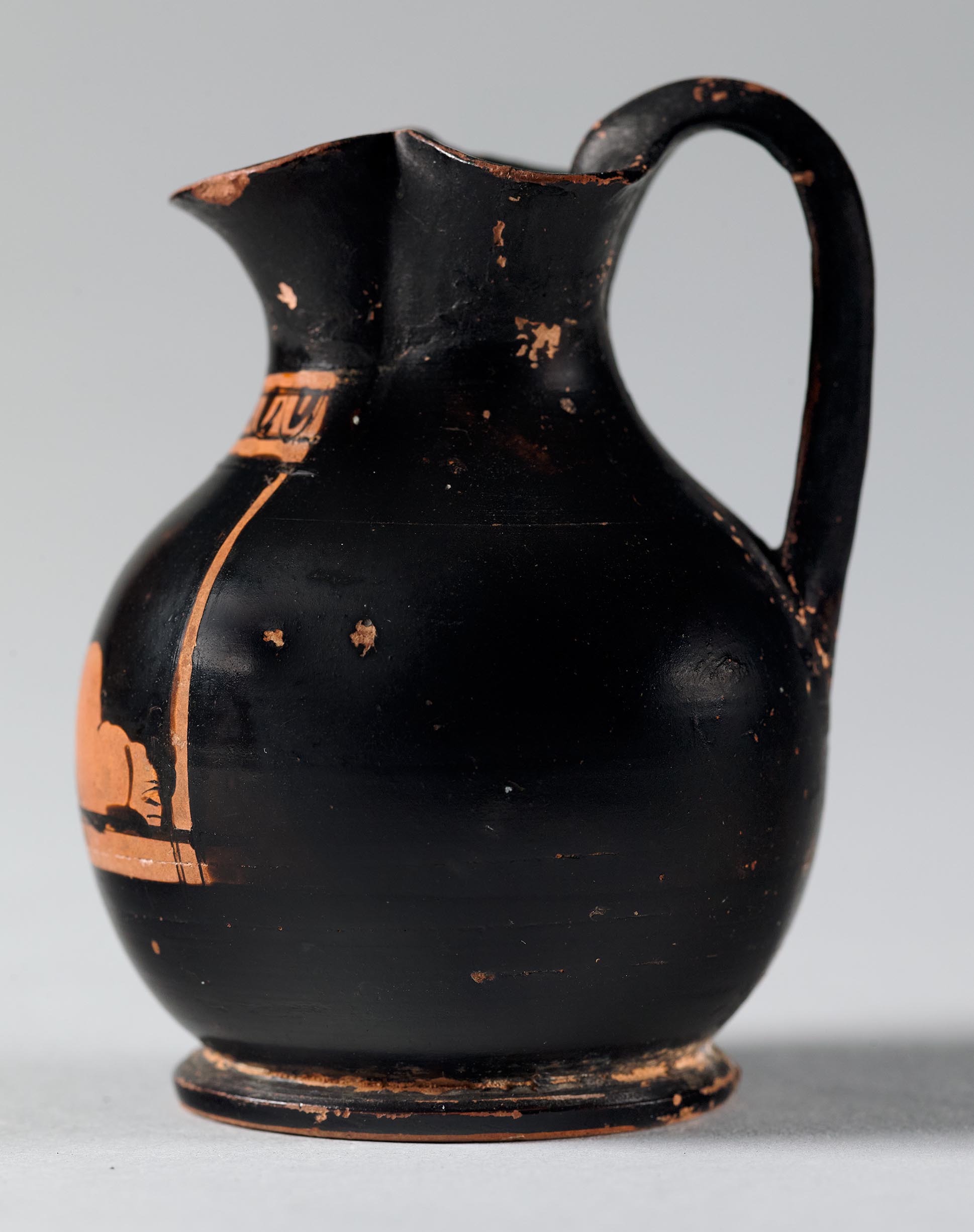 Side view of the vase, showing a partial figure on the right side