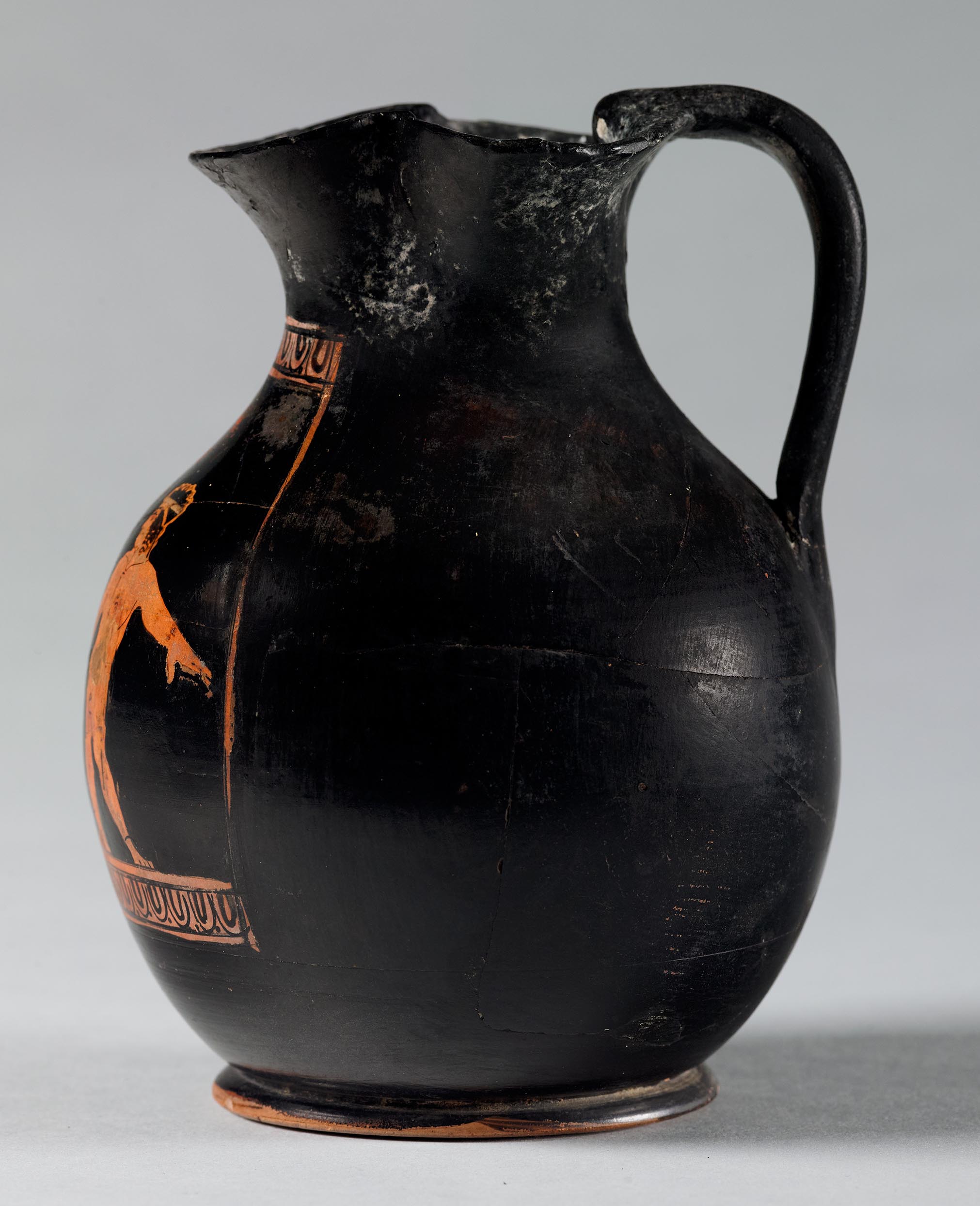 Side view of the vase, showing a partial figure on the right side