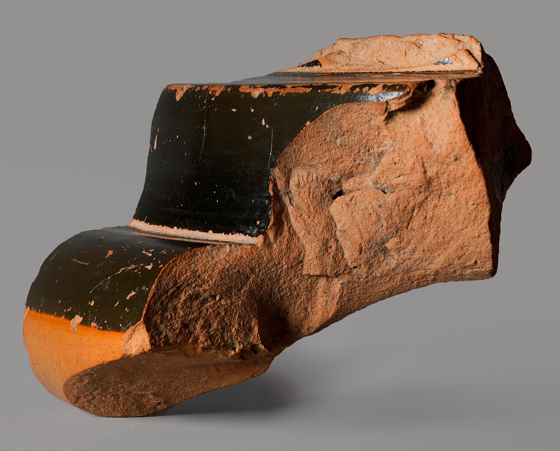 Exterior view of fragment that once formed a foot, with no decoration