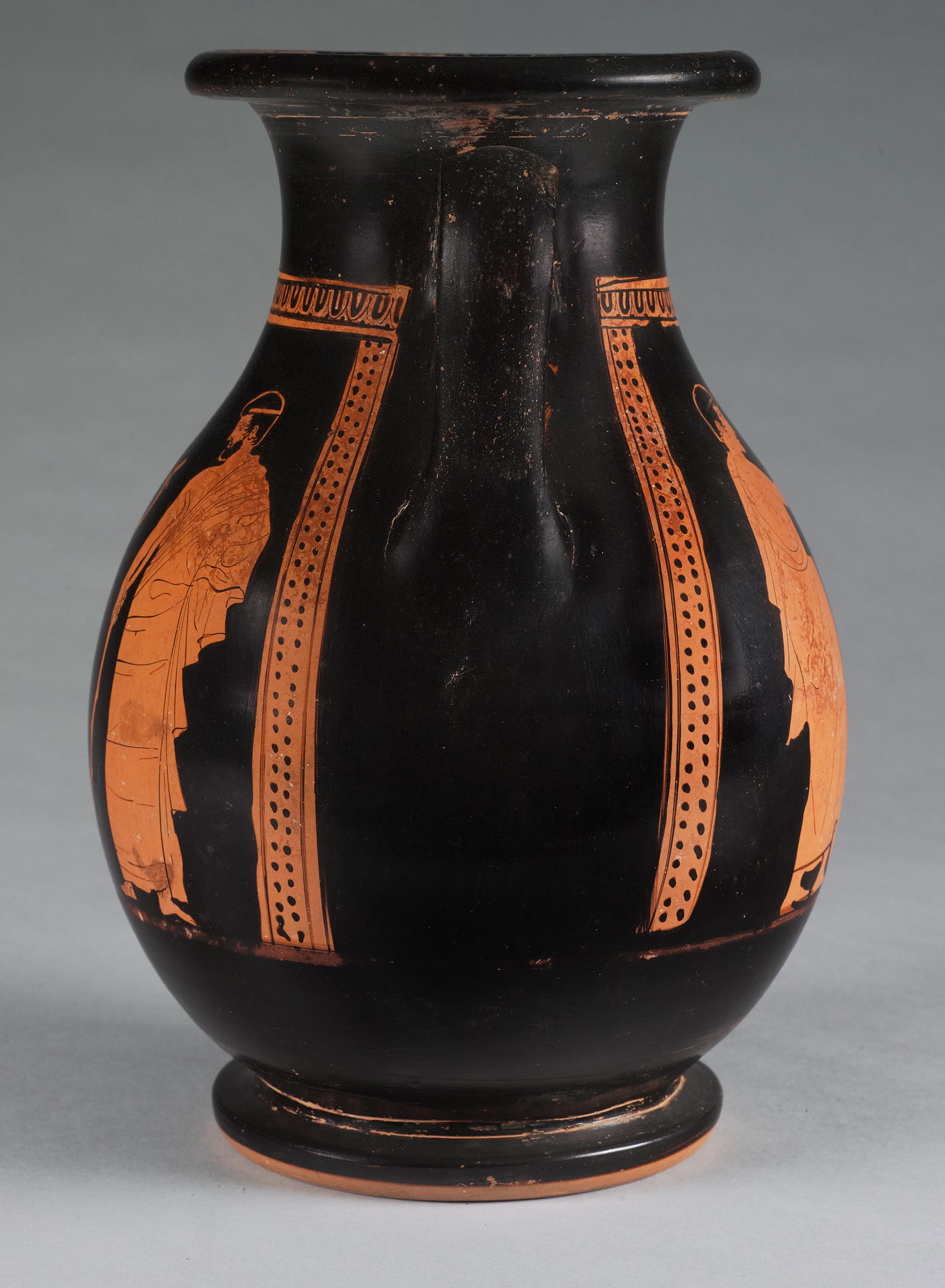 Side view of the vase, showing some decoration on the right side but not showing the figures
