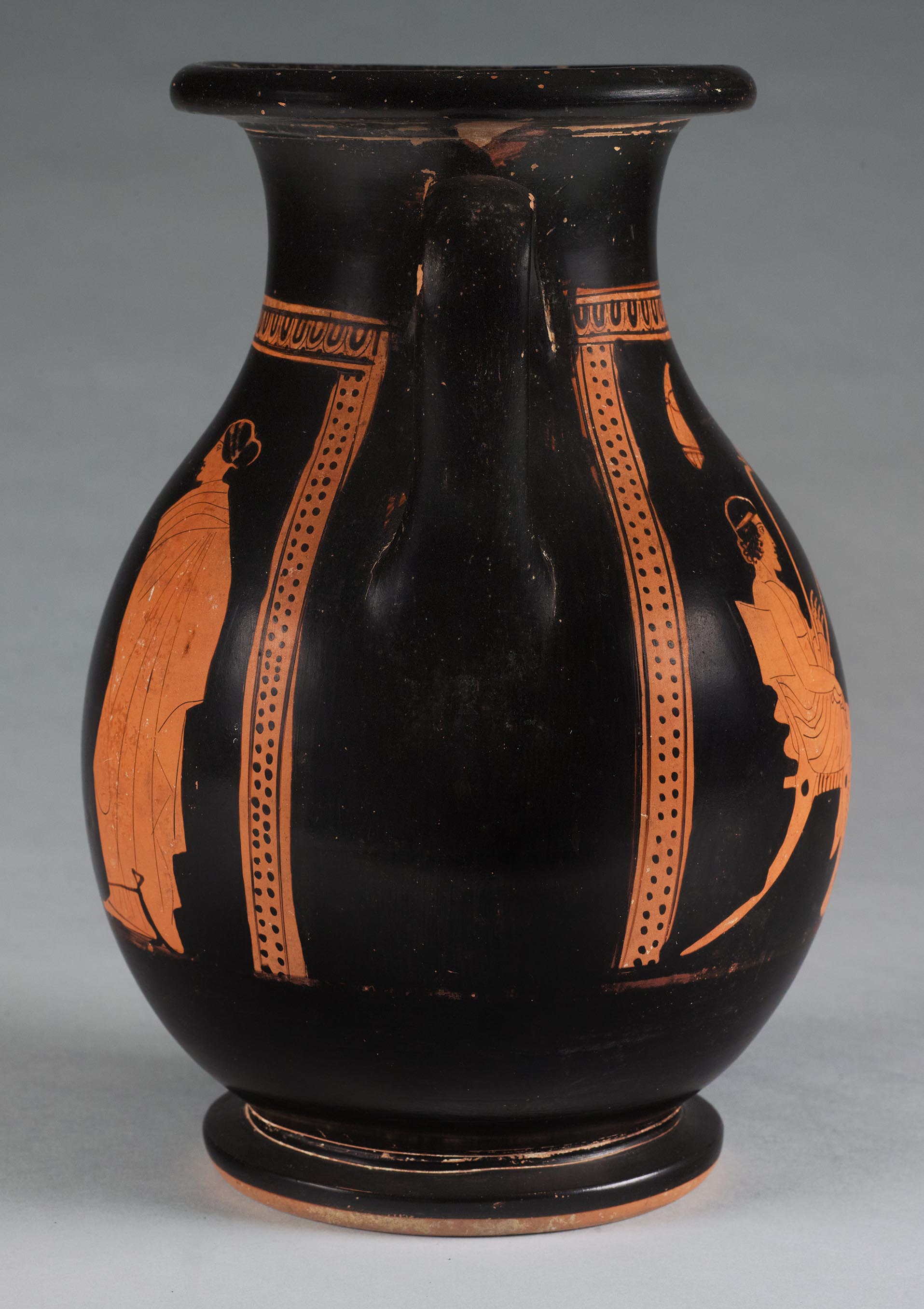 The other side of the vase, showing some decoration on the left side but not showing the figures