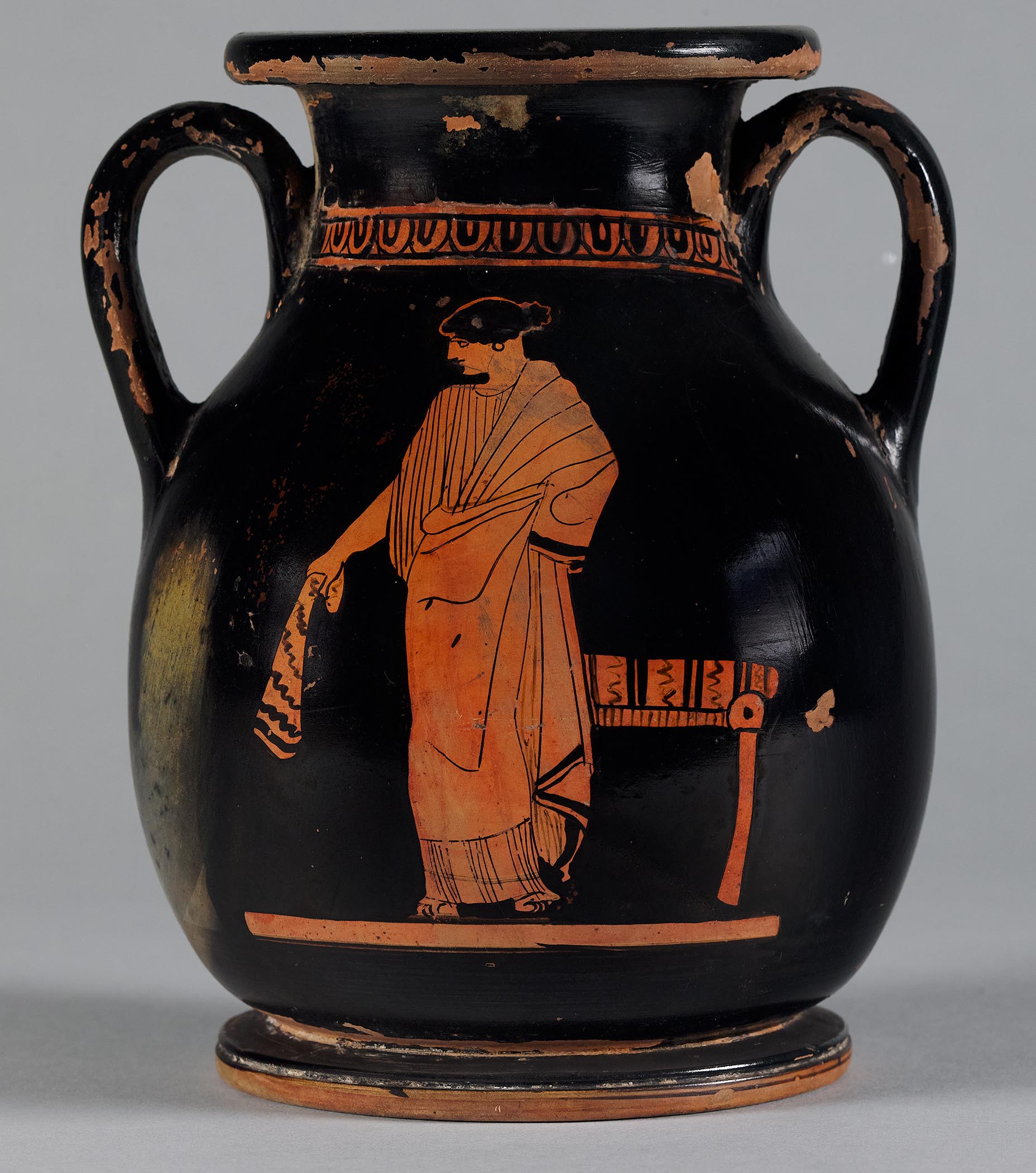 One view of a vase, the body depicting a standing woman