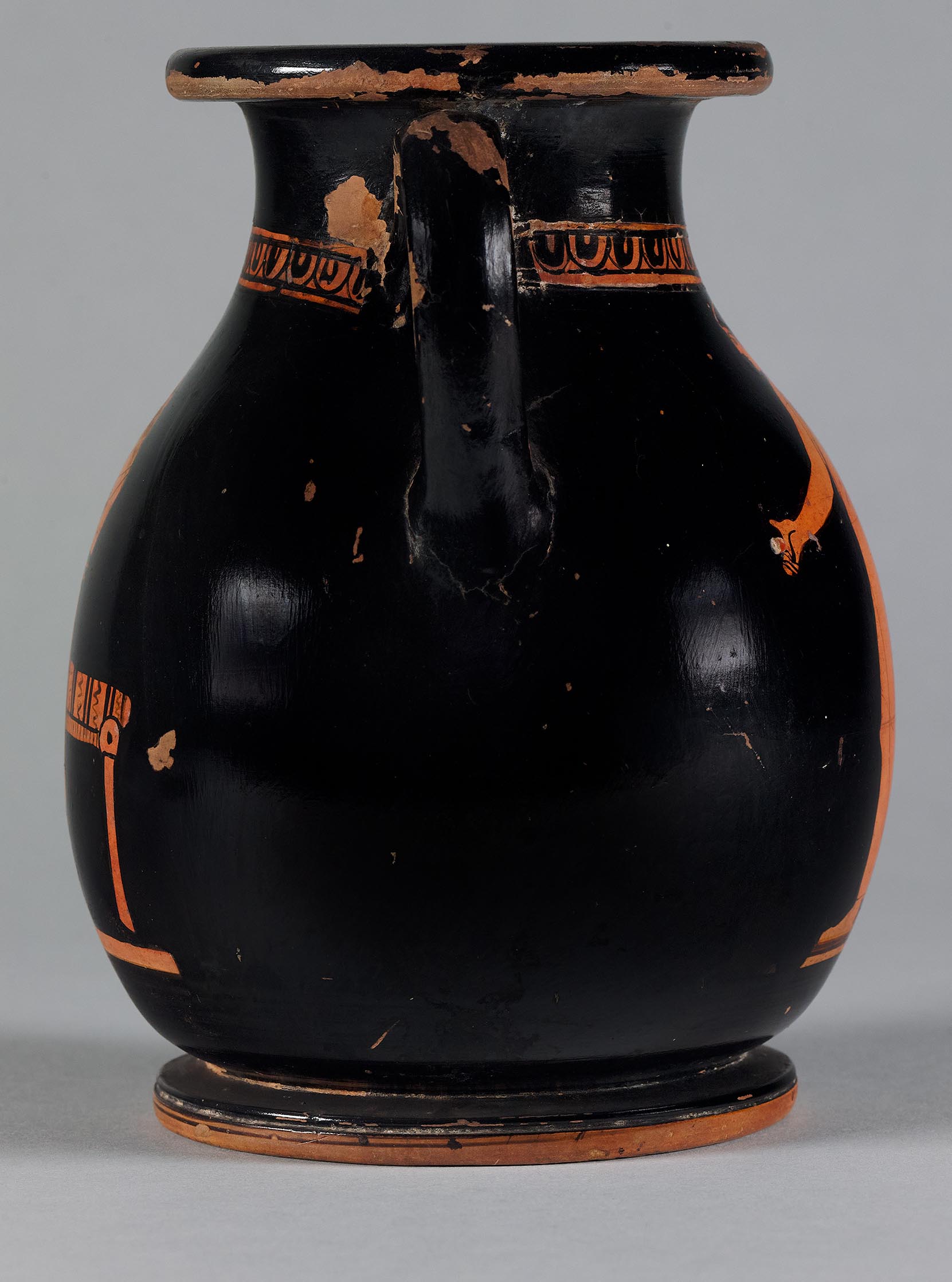 Side view of the vase, showing some decoration on the right side but not showing the figures