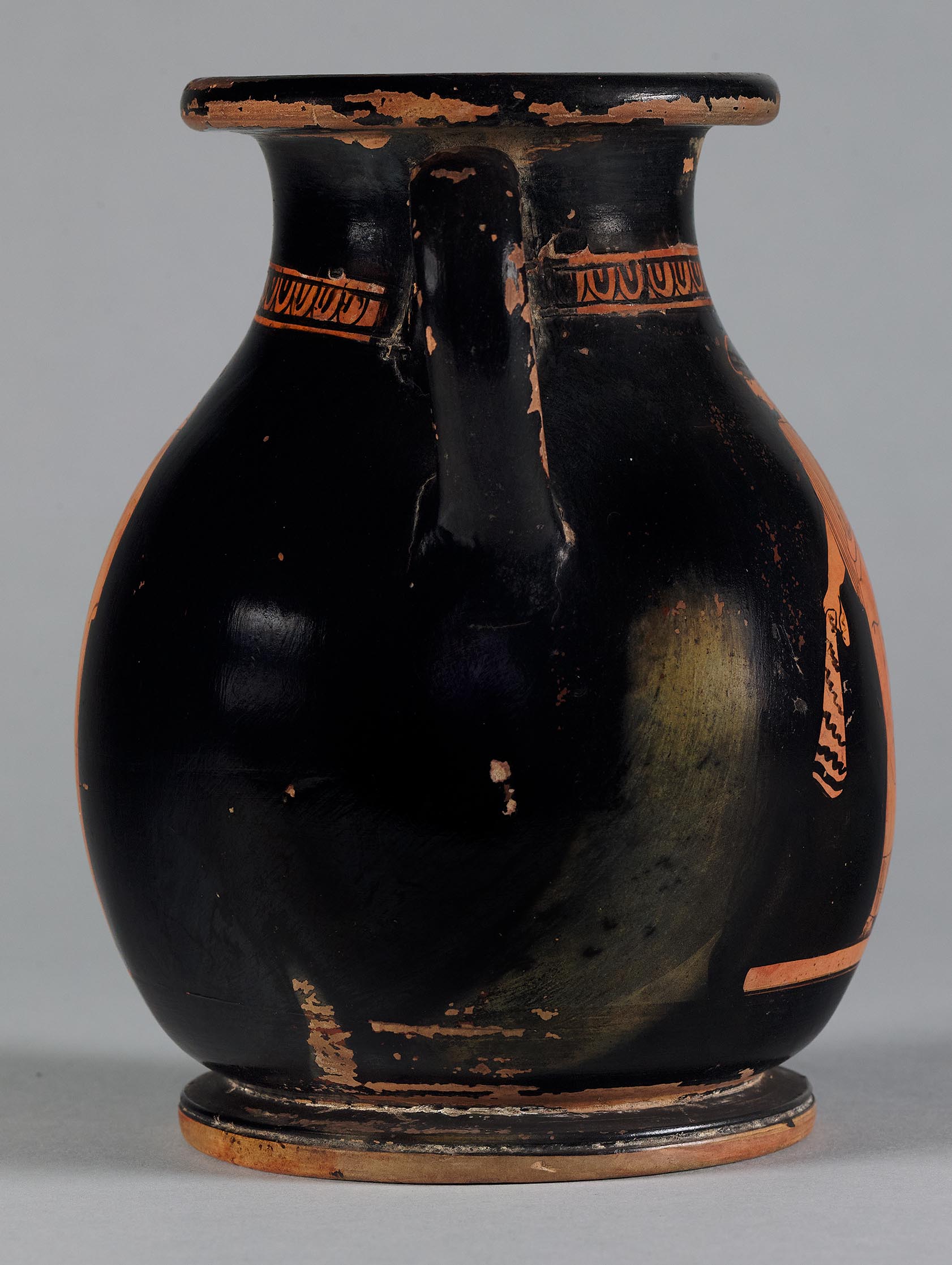 The other side of the vase, showing some decoration on the left side but not showing the figures